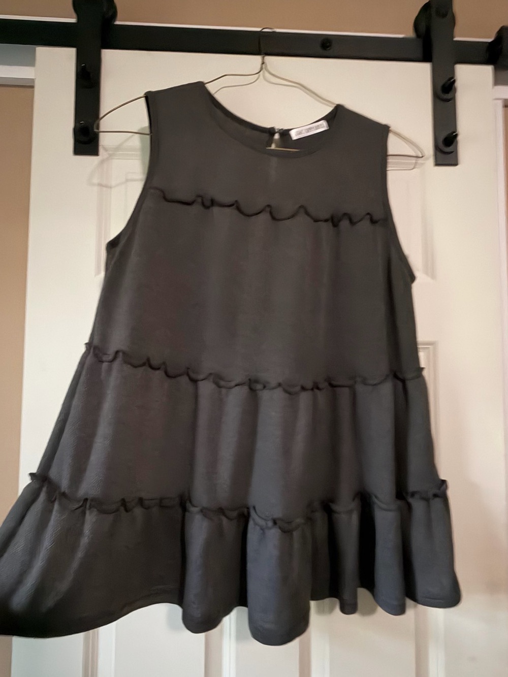 Woman’s Classic Black Tiered Ruffle tank